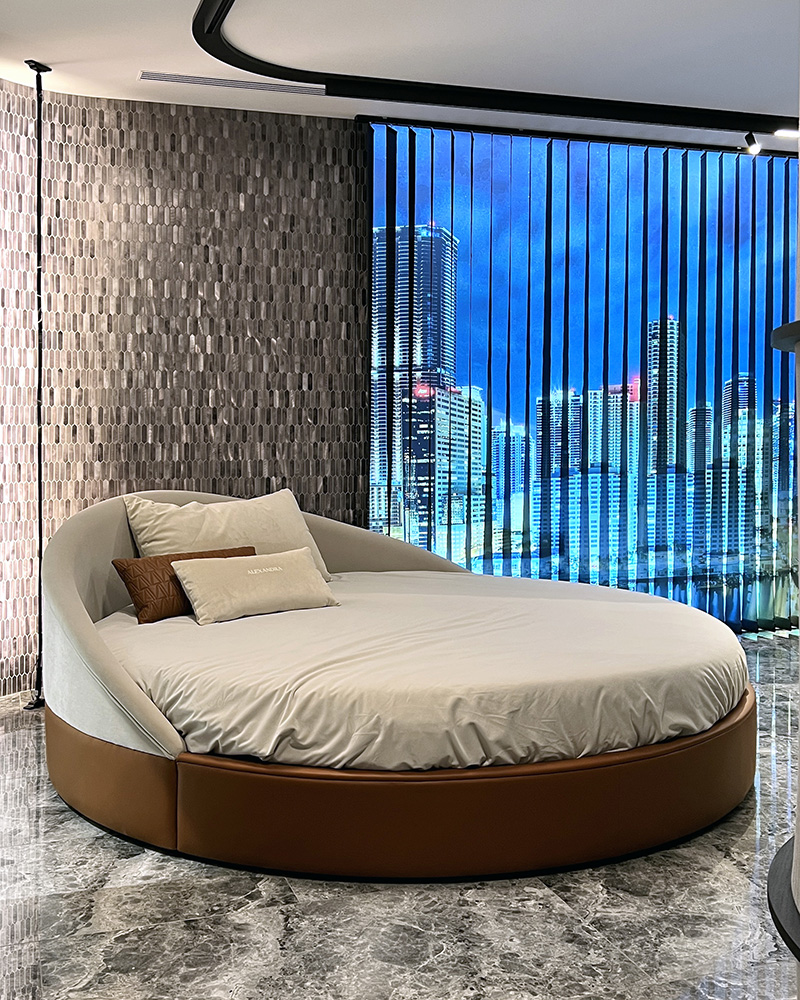 Arco round bed in a minimalist luxury bedroom.