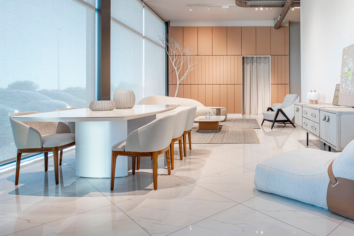 Bright white dining room with modern Wind table, contemporary Carla chairs and open space to the living room.