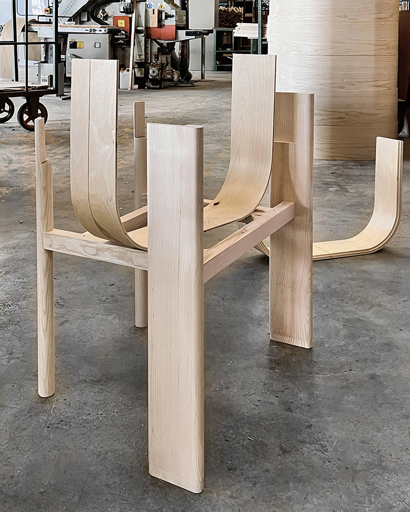 Modern design chair structures handcrafted to create curved shapes.